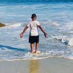 child in waves