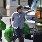 kids help distribute meals